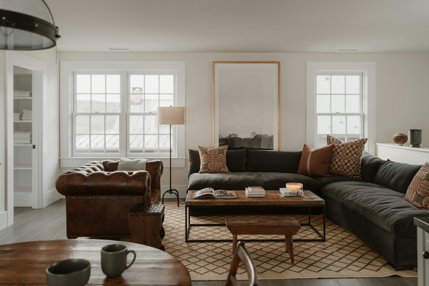 Living room with sectional sofa, armchair, floor lamp and coffee table